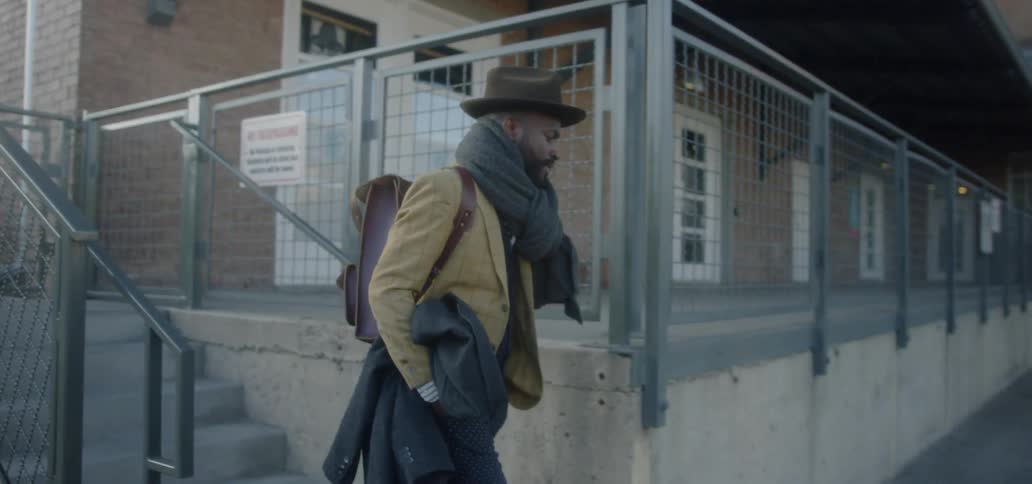 A man walks down the steps into the lot