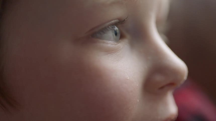 A child is staring off in front of him