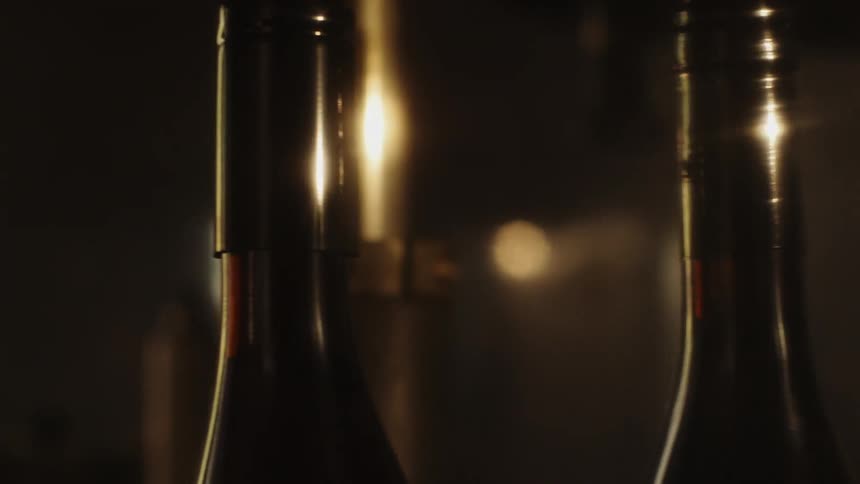A machine seals wine bottles