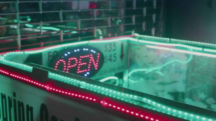 The small vender booth is flashing with lights