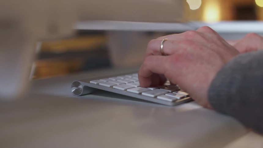 Man is typing on keyboard