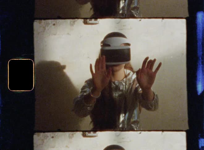 Girls uses virtual reality glasses and sits on a mattress in abandoned building