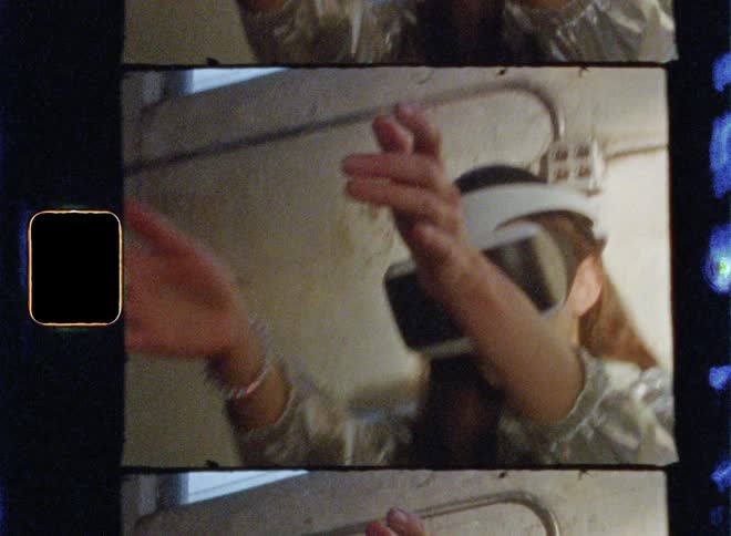 Woman wearing virtual reality headset is reaching out her hands