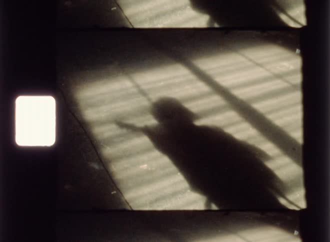 A guitarist plays in a run down building