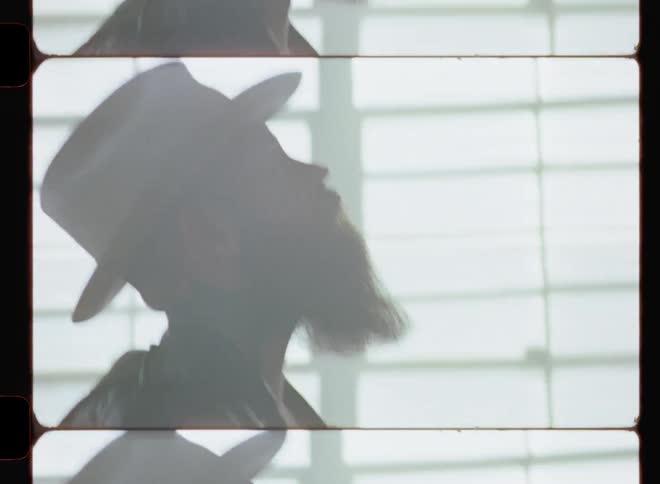 A man is looking up and playing the guitar