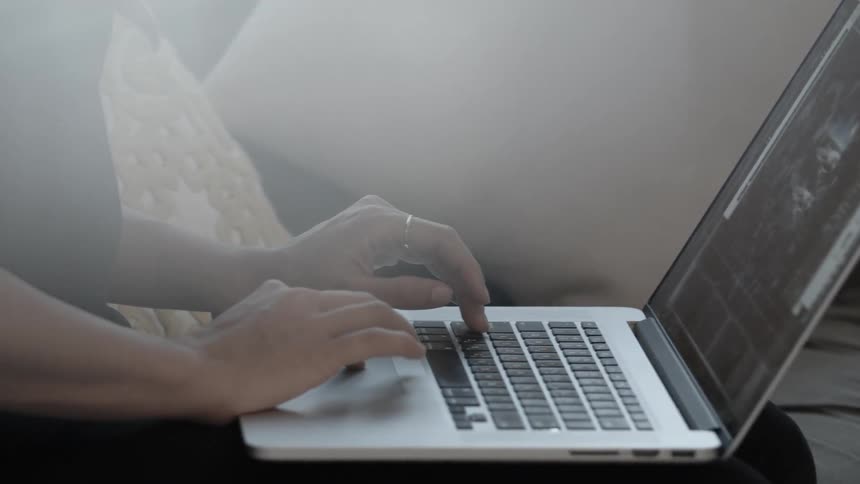Woman using a laptop in a comfortable area