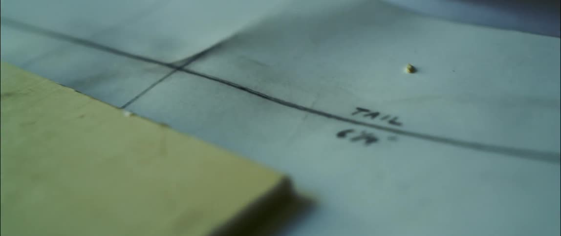 Measurements are written on paper