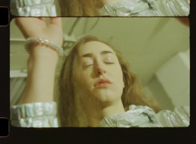 Woman dances in strobe lights