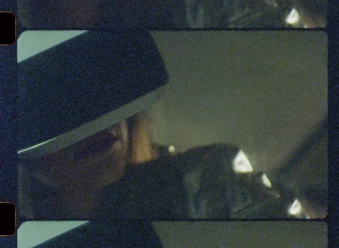 A woman using a virtual reality headset is waving her hand forward