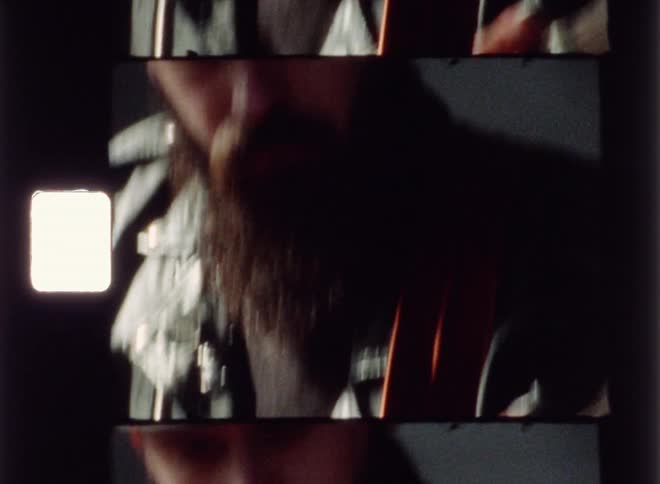 Man is playing guitar and nodding his head