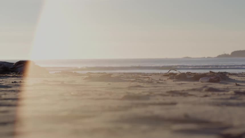 The waves slowly move and hit the shore