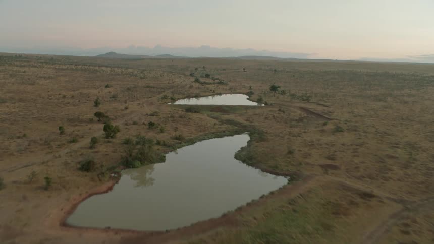 Small ponds of water in barren wilderness