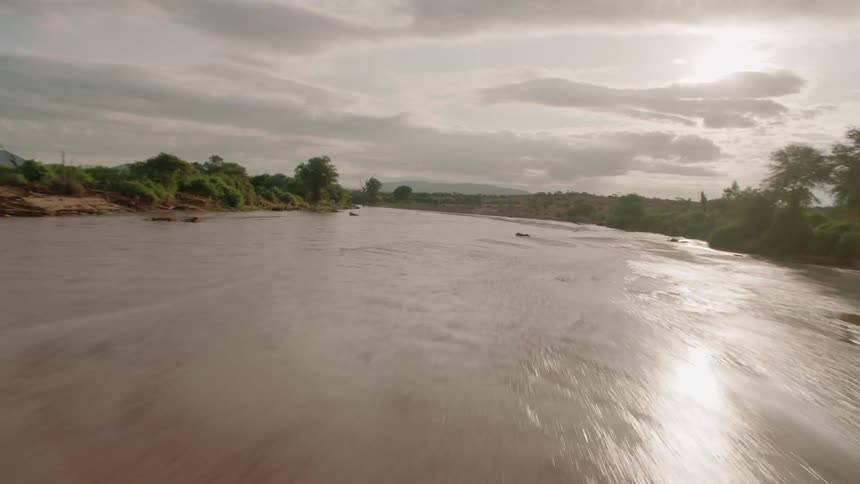 A river flows through a rural landscape