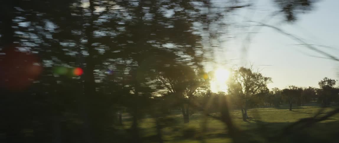 A car is driving through the country
