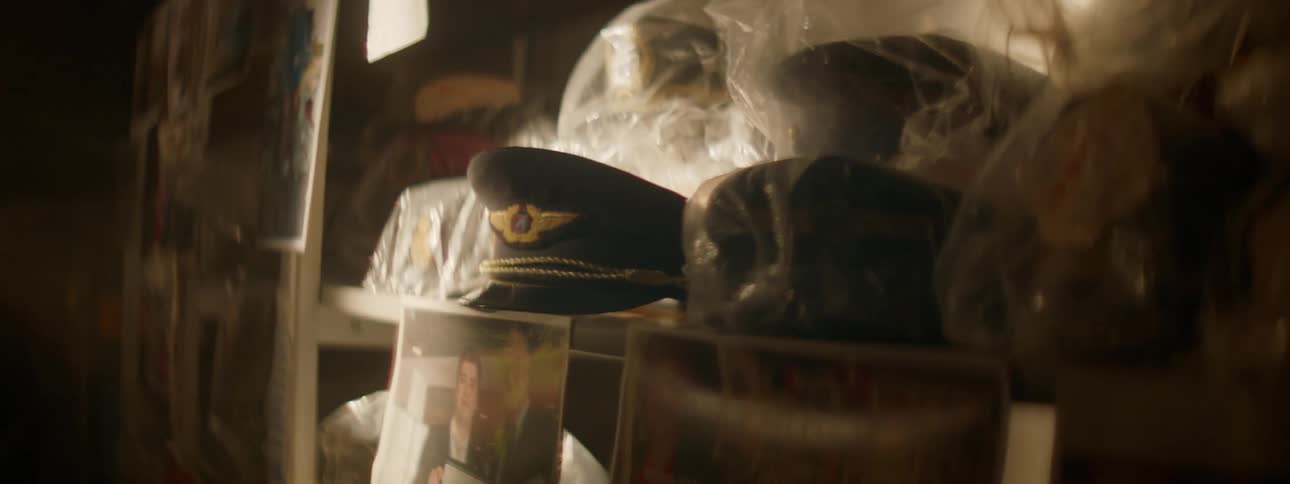 A light is passing over airline memorabilia sitting on shelves