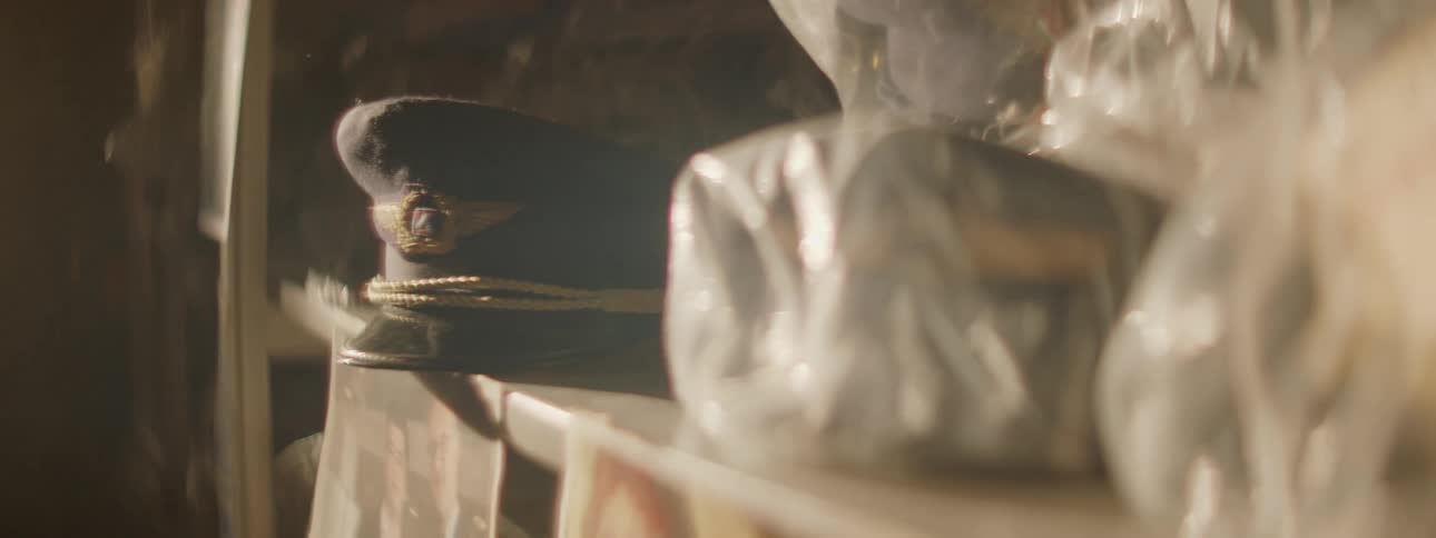 A light is passing over airline memorabilia sitting on shelves