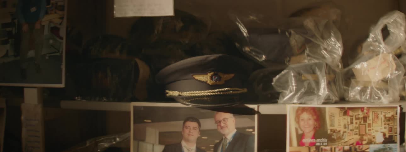 A light is flashing over airline memorabilia sitting on shelves