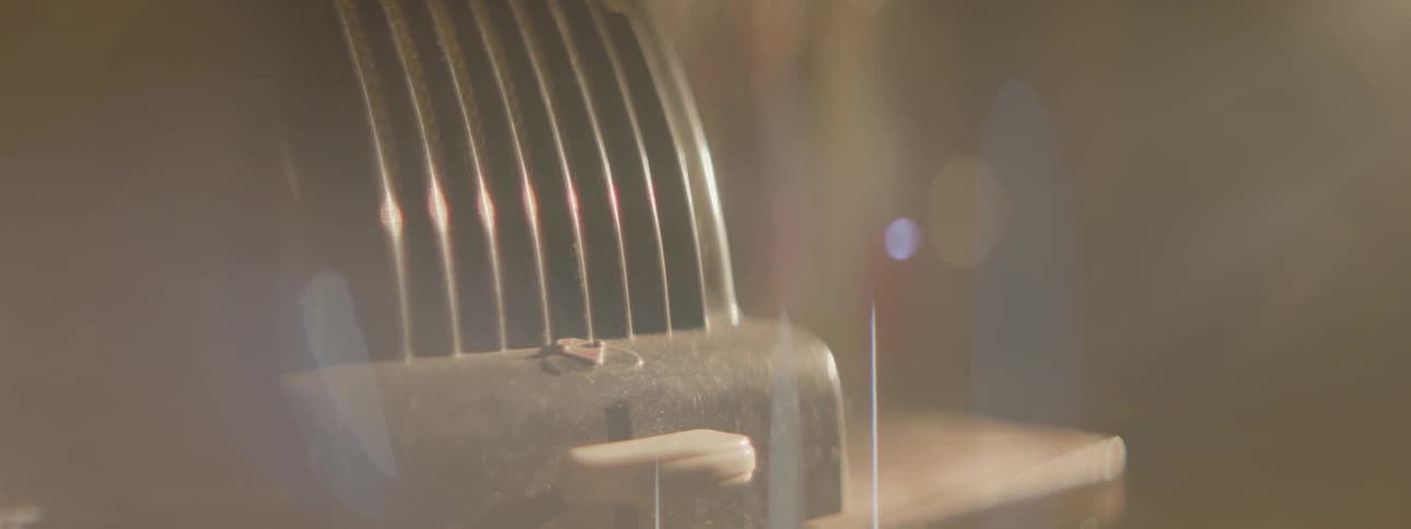 An old device sits on the dark table