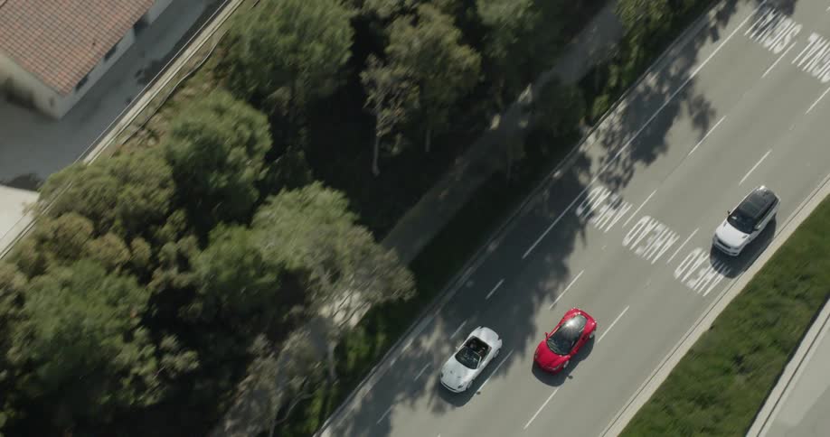 Vehicles travel on a city street