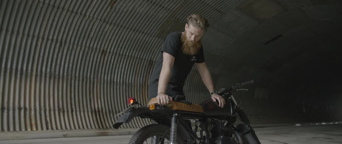 A man is looking at his bike
