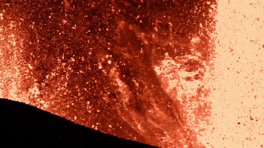A volcano spews lava