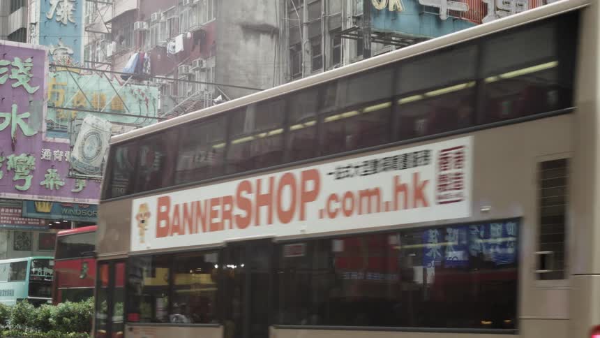 The city is busy with buses and people traveling