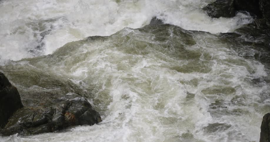 The water is splashing around the stream