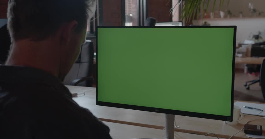 A man is typing on his keyboard