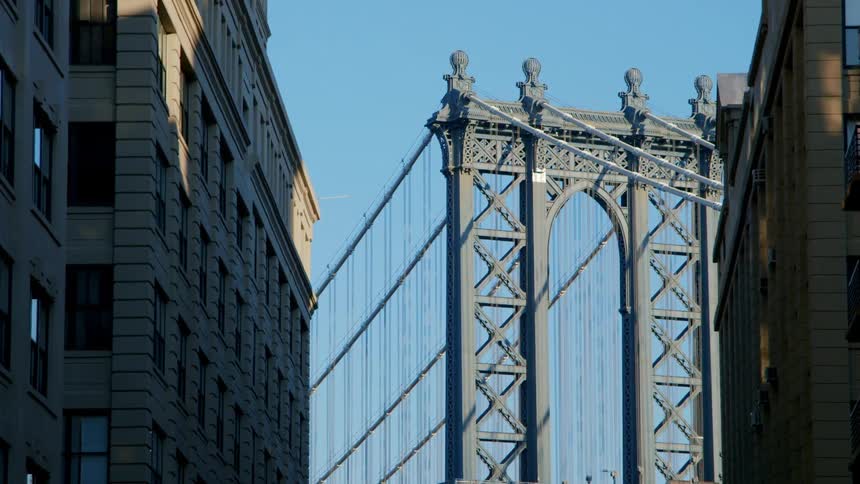 A bridge is standing in the distance in a city