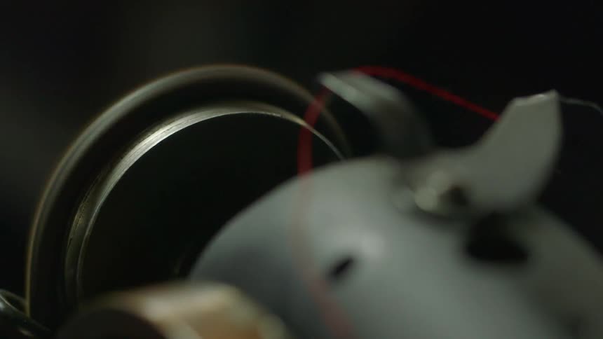 Wheel of a sewing machine spins rapidly