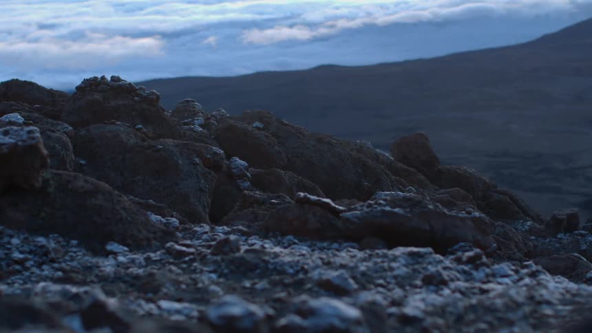 Rocky mountainous land on a cloudy evening