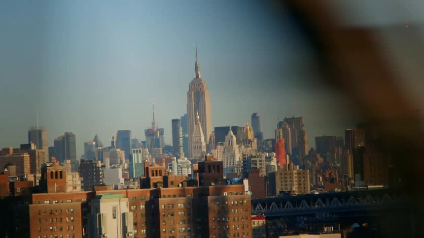 The city has many tall buildings on a sunny day