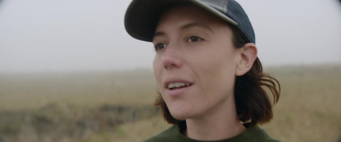 A woman photographs nature outside