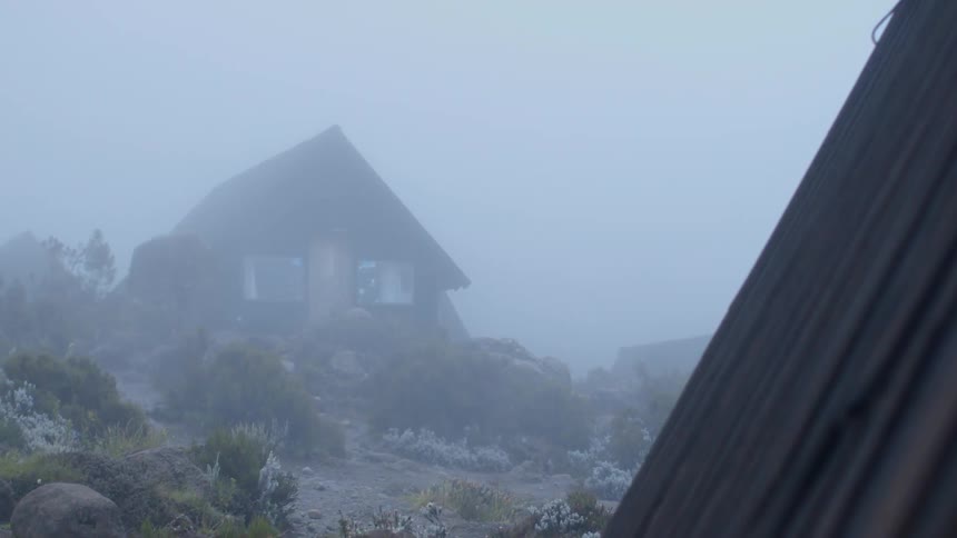 A house in the fog on a windy day