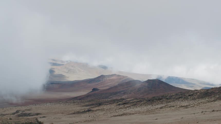 Clouds and fog cover hill peaks