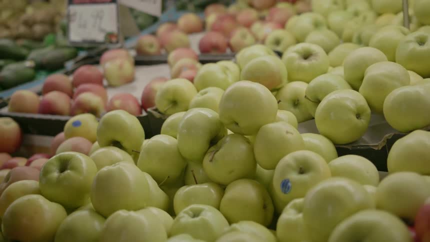 A man shops for produce at a market
