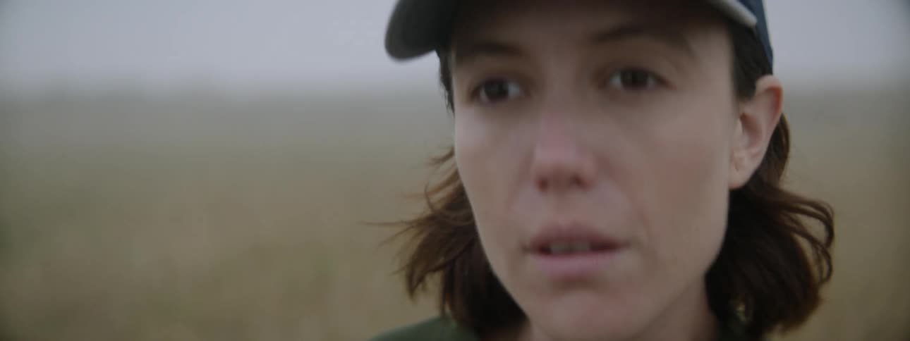 Woman takes pictures on a foggy day