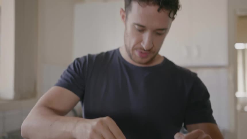 A man is cooking in the kitchen
