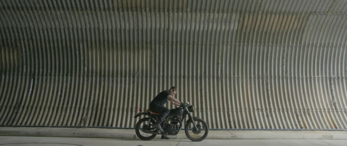 A man is riding his bike