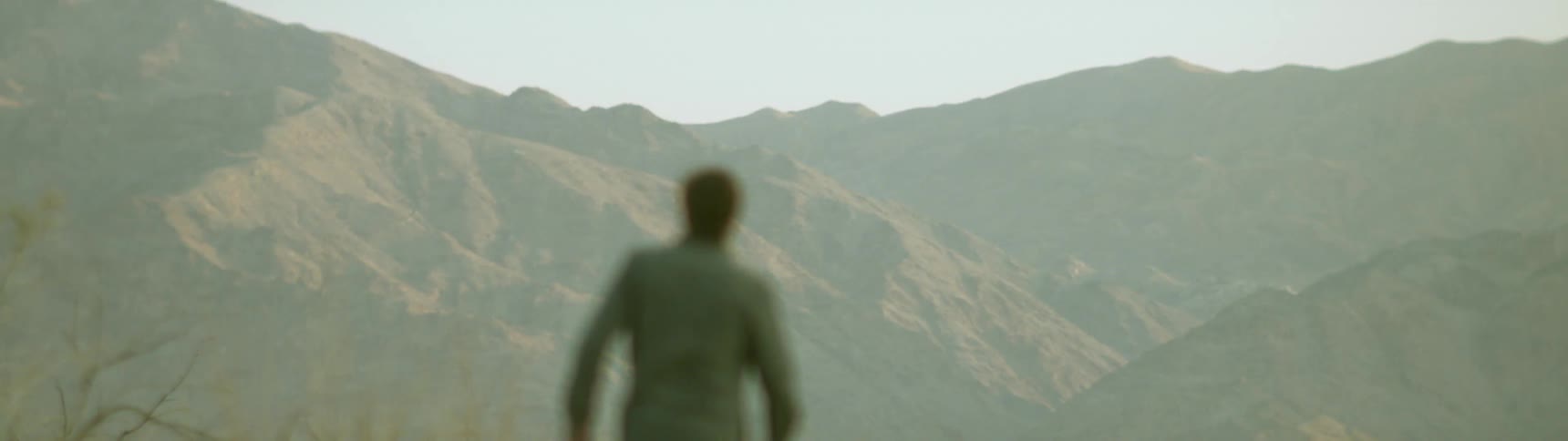 A man hikes in the mountains