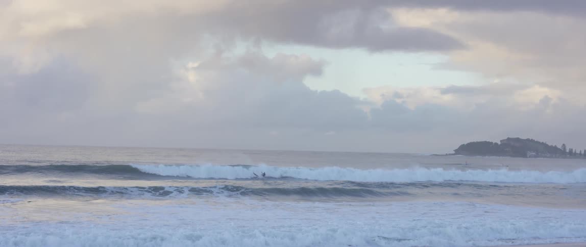 Waves crash on a rocky beach