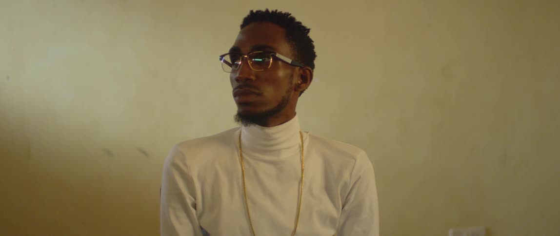 A man looks to the side in the room