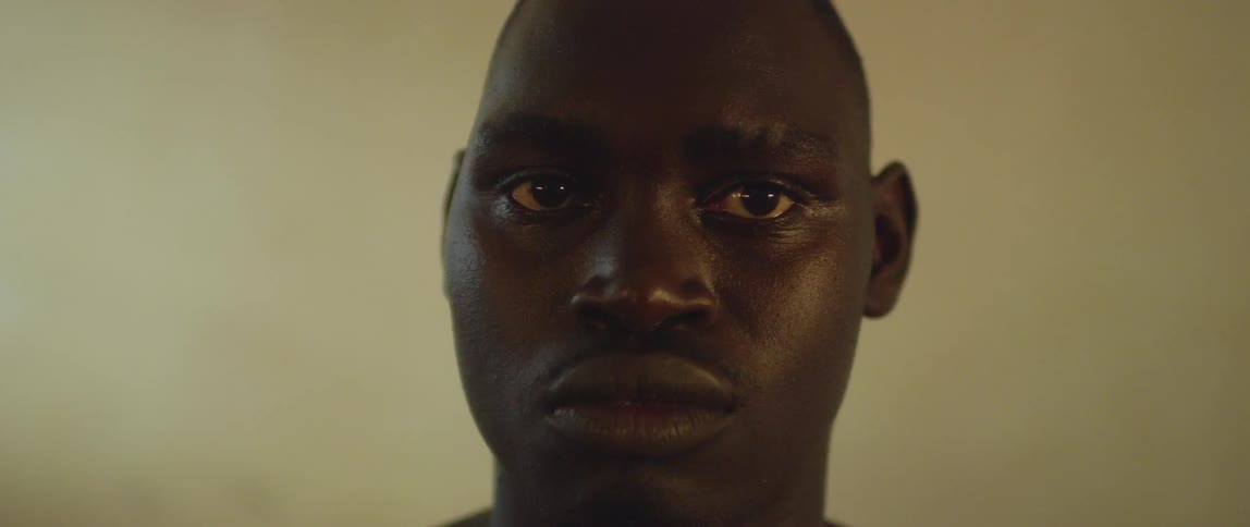 A man turns his head and looks straight ahead