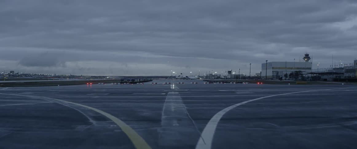 A plane is taxing around the runway of an airport