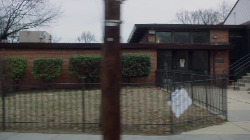 Driving by buildings on a city street