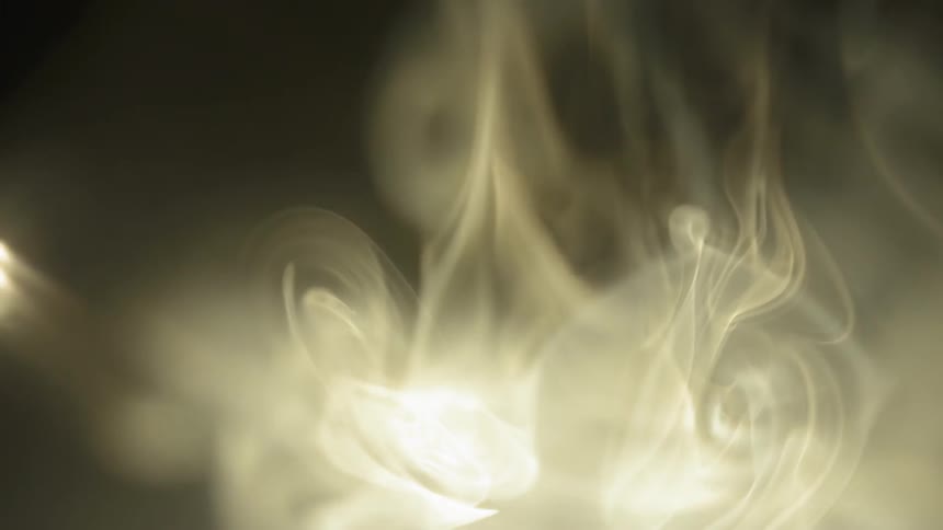 Smoke curls in the air