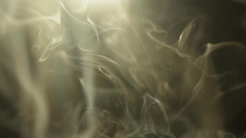 Smoke is twirling and curving in the air