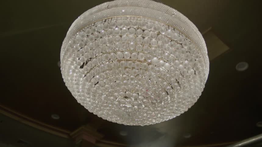 A crystal chandelier is hung from the ceiling