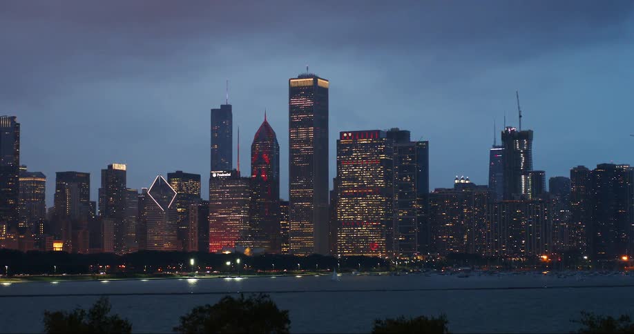 Large city across a river at a cloudy dusk