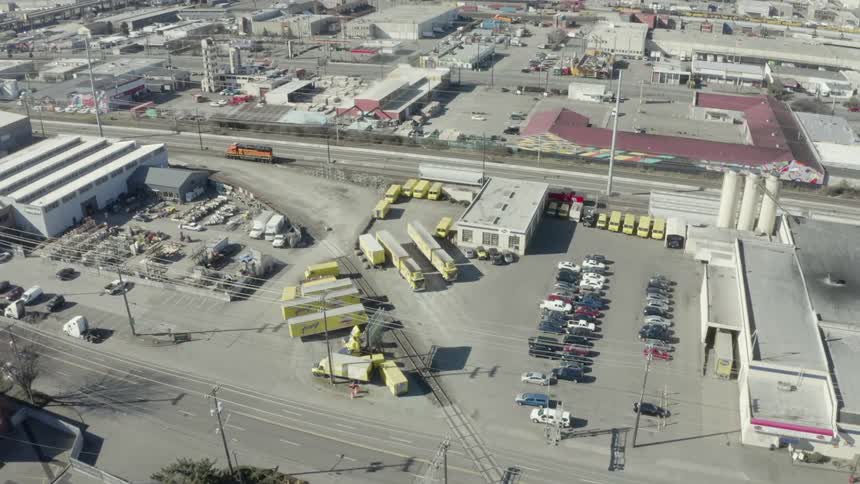 Cars and trucks are parked in a city